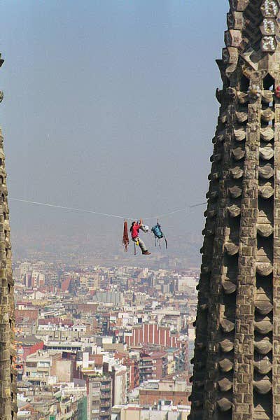 Protester hanging between spires of Sagrada Familia